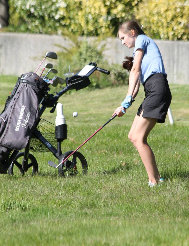 Slyssa Ludtke chips out of the rough in Wednesdays match.(Photo by Jim Waller/Whidbey News Group)