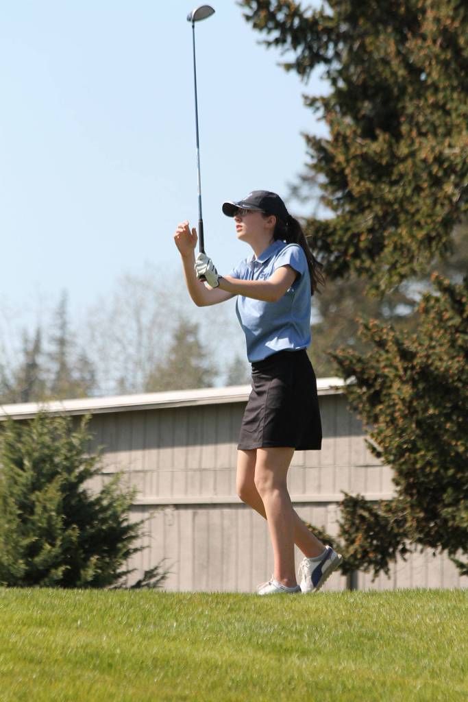 Tori Schuller follows her opening tee shot Wednesday.(Photo by Jim Waller/Whidbey News Group)