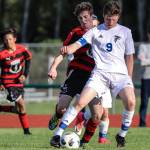 Ari Rohan protects the ball in the win over Mount Baker. (Photo by Matt Simms)