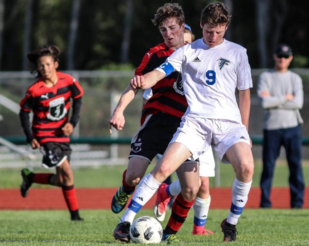 Ari Rohan protects the ball in the win over Mount Baker. (Photo by Matt Simms)