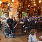 Roaming Radish owners J.P. and Jess Dowdell stand in the center of their gastropub open only three nights a week. Theyve been in the catering business many years and arent too worried about serving a few dozen travel, food and wine writers Tuesday evening. Were excited to showcase Whidbey, said Jess Dowdell.Photo by Patricia Guthrie/Whidbey News Group