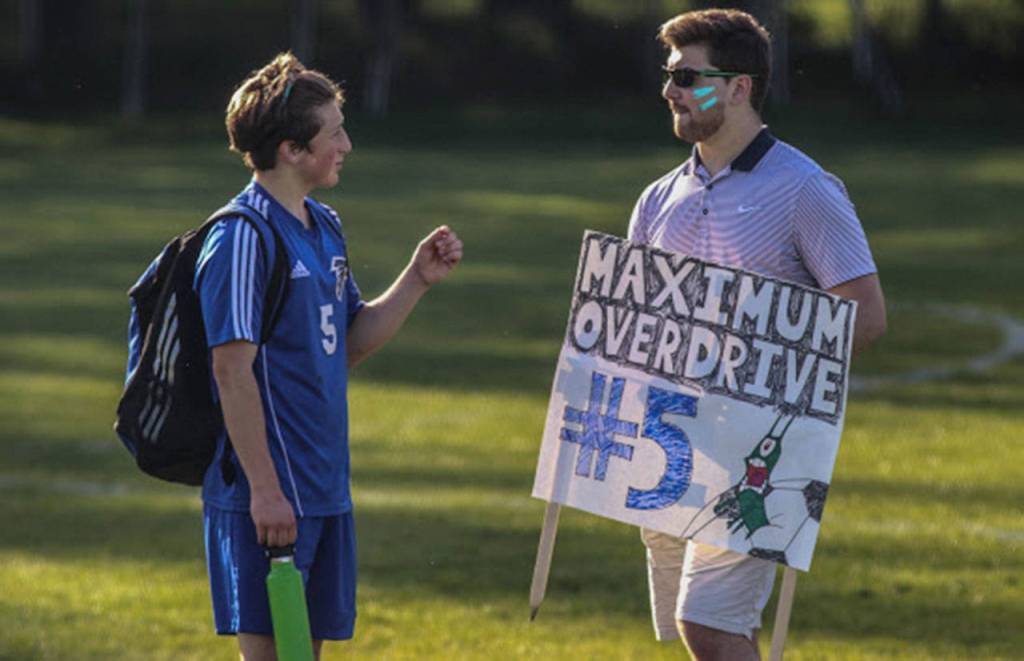 Cormac Workman, left, receives support from his older brother Conor, a student at Western Washington University. (Photo by Matt Simms)