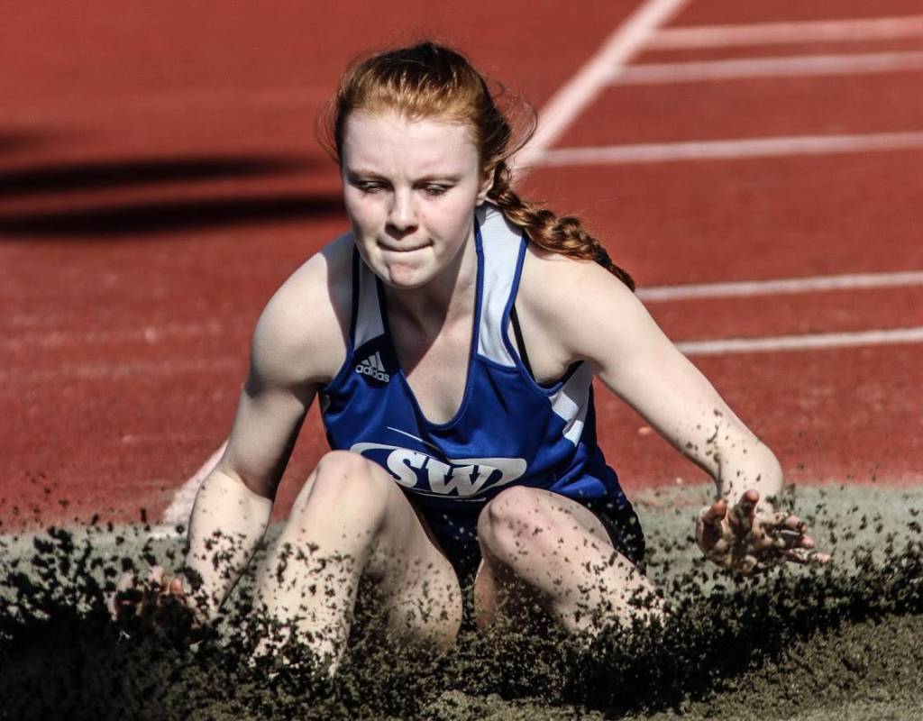 Mattason Straub hits the pit in the long jump.(Photo by Matt Simms)