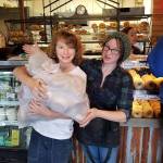 Spencer Jones got some help from Alex Hurt managing a large and heavy bag of fresh bagels donated by John Auburn of the Bagel Factory in Clinton. The bagels were picked up on the day of the food drop-off for maximum freshness. Photo provided