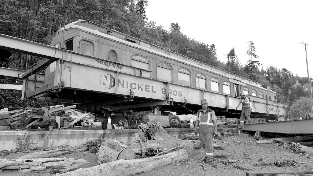Courtesy Photo                                Nickel Bros. workers move the parlor car from its shelter to the ship that will carry it across the water.