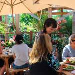 After being closed two months for renovation, Flower House Cafe in Bayview reopened over the weekend. Server Mary Petosaprovides lunch to two diners Monday. Photo by Patricia Guthrie/Whidbey News Group