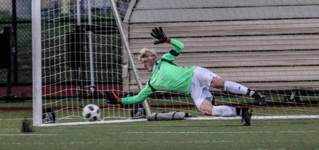 Julian Inches makes a diving save in the shootout, setting up the Falcons win.(Photo by Matt Simms)