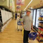 Goose shopper Rick Knight wonders why the deli case is empty as he looks for milk and yogurt Monday afternoon. Where did they put everything? he asked.