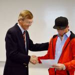 Island County Superior Court Judge Alan Hancock hands drug court graduate Conrad Standinger the dismissal of his charges, which Standinger earned after over 700 days in the rigerous court program. Photo by Laura Guido/Whidbey News Group
