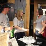 Jake and Lindsay Krug talk to customers trying out their Driftwood Hard Cider during a spring tasting. Its currently served at three Whidbey bars and restaurants. Photo by Patricia Guthrie/Whidbey News Group