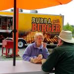 Judith and Perry Lovelace of Useless Bay split a gyro sandwich at the seasonal Bubba Burger in Freeland.