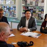 Translator Elmurad Kasym, center, helped government officials learn how Langley markets itself. Although he speaks English, Uzbek, Russian and Turkish, some Whidbey Island concepts just didnt translate, such parades for whales.
