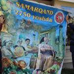 Music for the Eyes store owner Fred Lundahl (left) stands with Furqat Rakhimov, mayor of Samarkand, a city in Uzebekistan situated at the crossroads of the Silk Road. The banner uses the Uzbek spelling of the city and advertises its 2,750 year-old history.