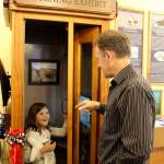 Scott Price and his daughter, Lydia, try out the Pat Price Ocean Listening Booth at the Langley Whale Center. They narrated for the computerized exhibit thats named in honor of their mother and grandmother.