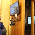 Corbett Bogner, 6, giggles while listening to a certain sound at the underwater listening booth installed at the Langley Whale Center. Its named in honor of Pat Price, a longtime volunteer who died in 2016. Photos by Patricia Guthrie/Whidbey News Group
