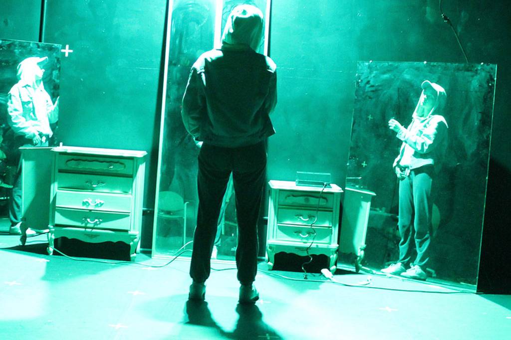 Scorch is a play about gender identification showing at Outcasts black box theater on the Island County fairgrounds June 13-17. Its a one-person play, performed by Carmen Berkeley. Director and co-producer Ty Molbak went to middle school in Langley was was active in Whidbey Childrens Theater. Both will be seniors at Rutgers University in the fall. One scene in the play Scorch portrays the main character looking into mirrors and wondering what others see.