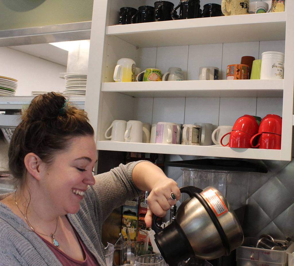 Ryan Woods pours coffee into the mishmash of mugs that have been a trademark at Braeburn.