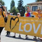 Members of Freelands Unitarian Universalist Congregation of Whidbey Island carry a banner expressing their sentiment about acceptance.