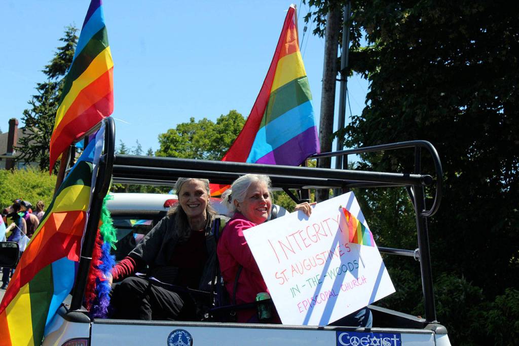Friends Jill Hershberger and Melahn Murphy rode in the decorated truck of St. Augustines in-the-Woods Episcopal Church.
