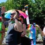 Parade organizer Skye Newkirk encourages people to keep cheering and dancing toward the end of the fifth annual Queer Pride Parade.