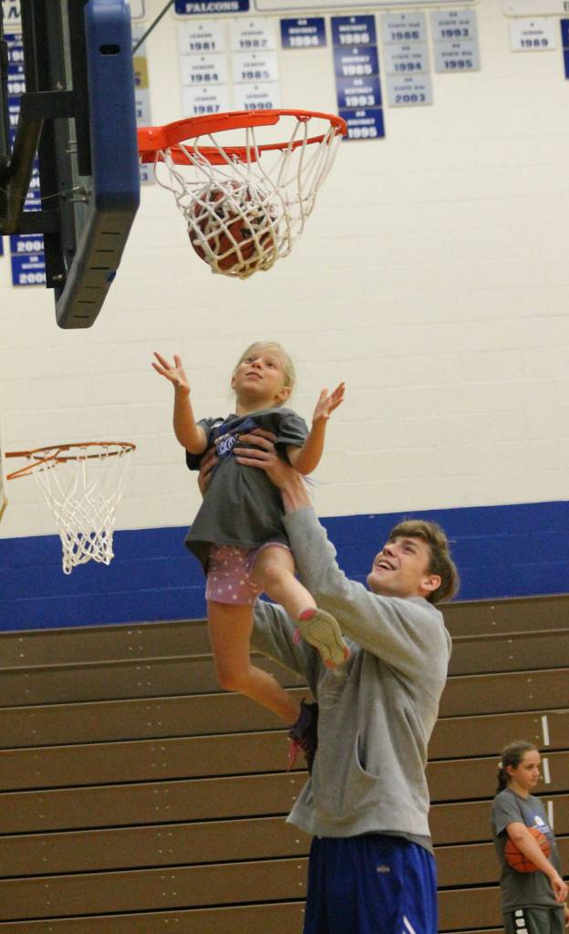 South Whidbey varsity basketball player Carson Wrightson gives a camp a boost.(Photo by Jim Waller/South Whidbey Record)