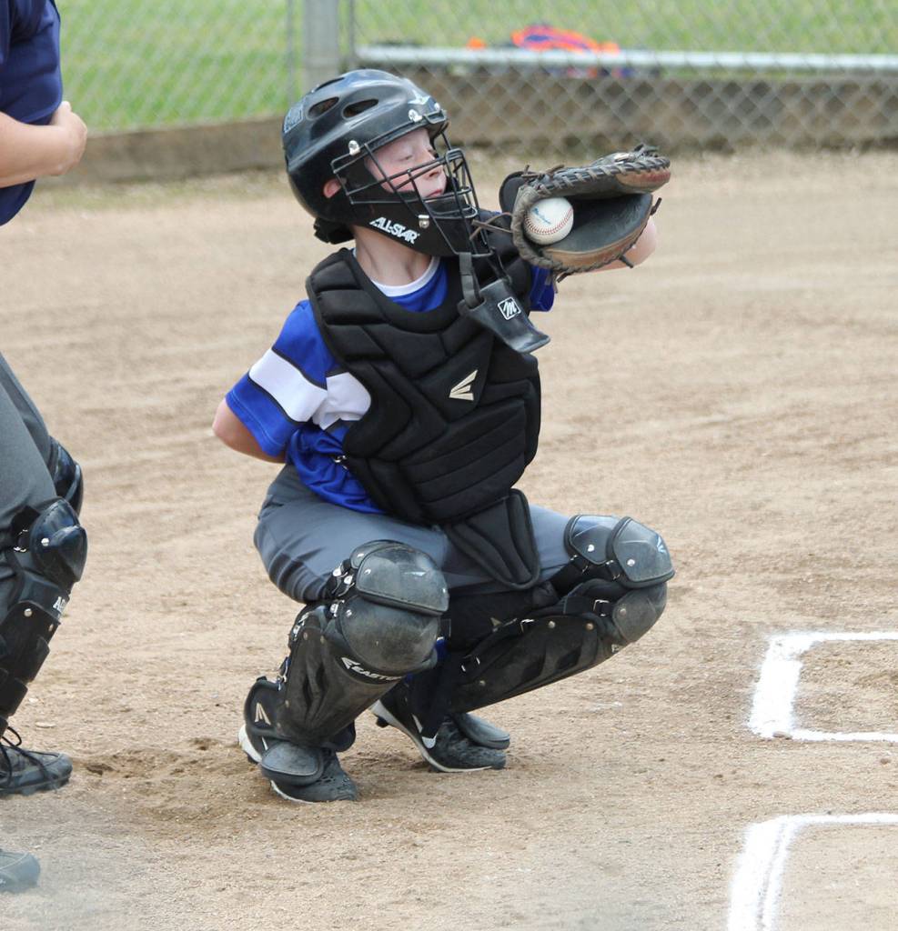 South Whidbey catcher Cohan Criswell snags an outside pitch. (Photo by Jim Waller/South Whidbey Record)