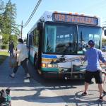 Passengers get off and on in Coupeville on a southbound Island Transit bus Tuesday morning. The transit systems board voted against charging fares. Photo by Patricia Guthrie/Whidbey News Group