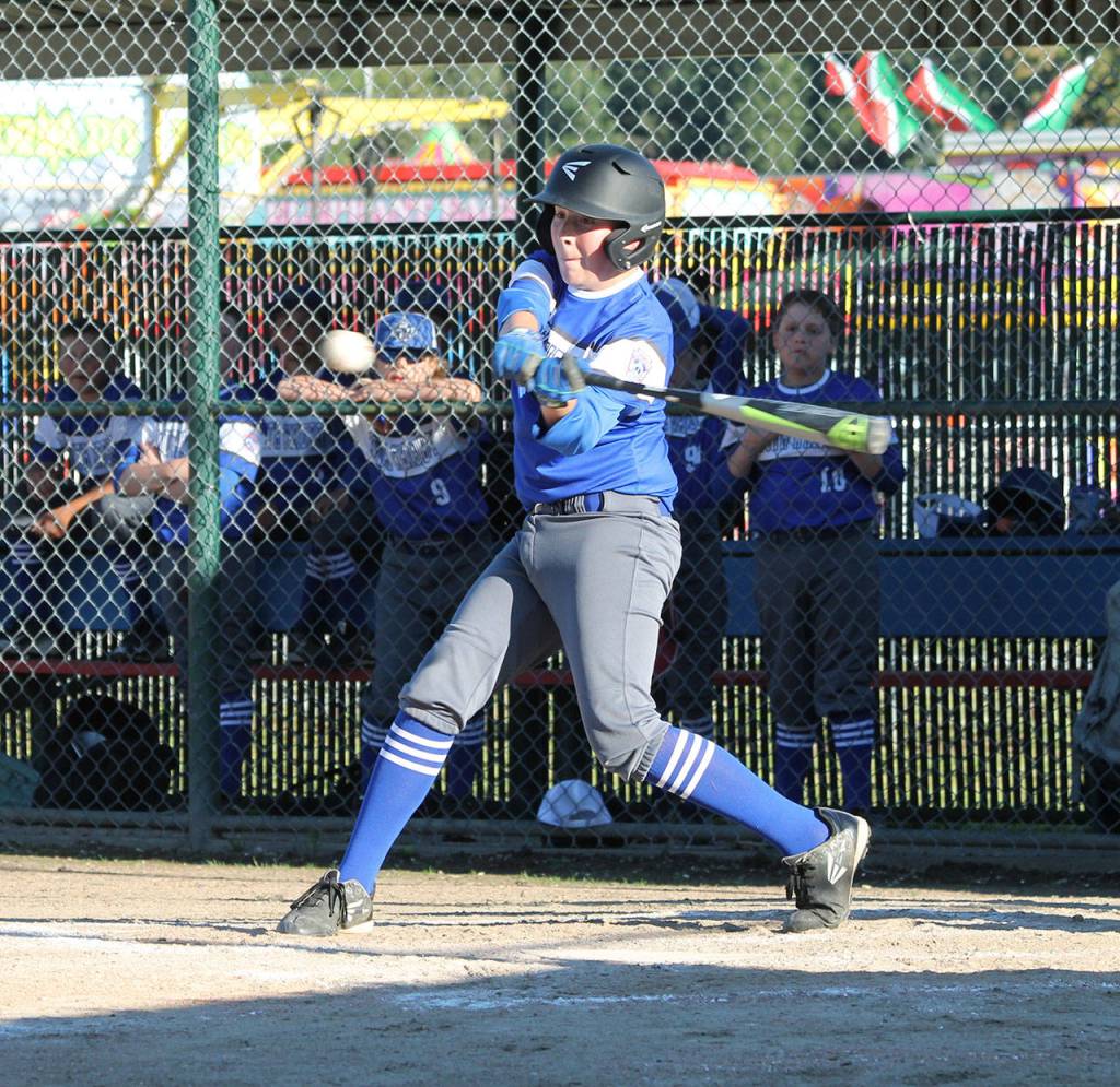 Mathias Pierson rips a double for South Whidbey.(Photo by Jim Waller/South Whidbey Record)