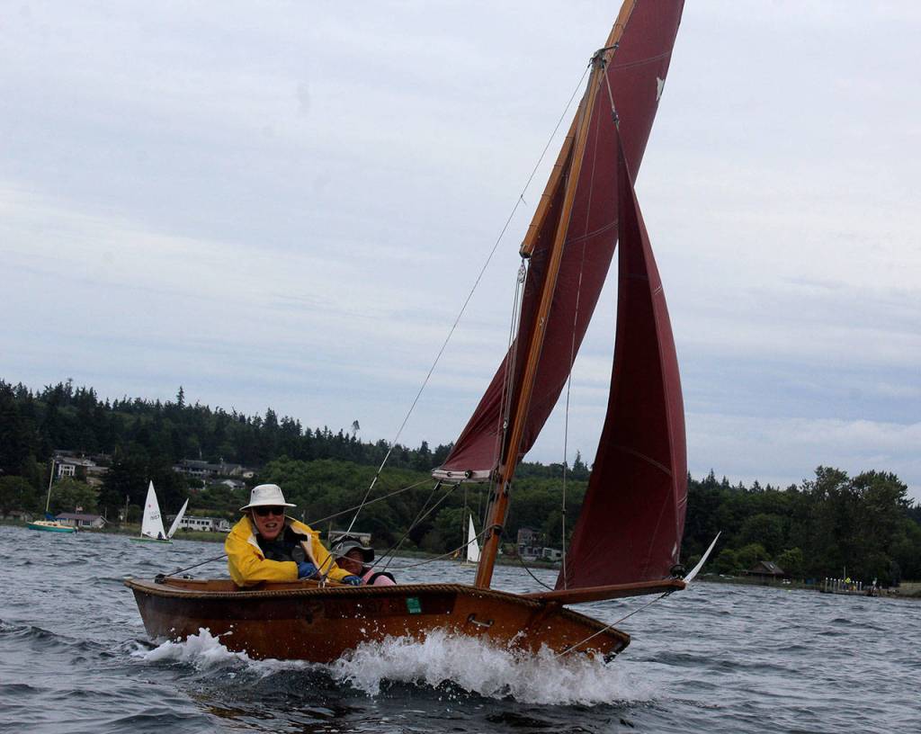 Perry Lovelace and Peter Bunin pick up a gust of wind during a recent race. We exist to teach people how to sail, Lovelace says of the South Whidbey Yacht Club.