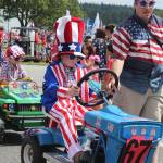All types of vehicles and groups were part of the popular Maxwelton 4th of July Parade in South Whidbey. Thousands turned out under sunny skies for the red, white and blue event that celebrated its 103rd year.                                Photo by Patricia Guthrie/Whidbey News Group