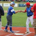 South Whidbeys Kasen Parsell, left, shakes hands with a Richland player during the pre-game introductions.(Photo by Jim Waller/South Whidbey Record)