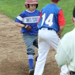 Alexander Zarifis cruises into third base in the third inning.(Photo by Jim Waller/South Whidbey Record)