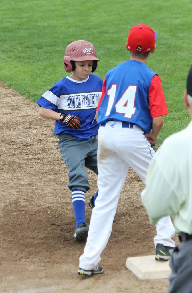 Alexander Zarifis cruises into third base in the third inning.(Photo by Jim Waller/South Whidbey Record)