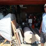 Dave Madeiros stands in front of his garage, where he keeps the materials he uses for his flooring business that he has owned and operated since 2001. He still lives in the first home he bought in Oak Harbor after being homeless for a two years. Photo by Emily Gilbert/Whidbey News-Times                                Photo by Emily Gilbert/Whidbey News-Times                                Dave Madeiros stands in front of his garage, where he stores materials he uses for his flooring business that he has owned and operated since 2001.