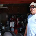 Photo by Emily Gilbert/Whidbey News-Times                                Dave Madeiros stands in front of his garage, where he stores materials he uses for his flooring business that he has owned and operated since 2001.