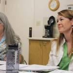 After six years working at the Port of South Whidbey, Angi Mozer, right, is leaving her position as executive director because her Navy husband is being posted to Australia. Tuesday, port commissioners thanked her for her service at a meeting, calling her performance way above the job description and our expectations. Seated with Mozer is port clerk Molly MacLeod-Roberts.
