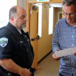 Officer Don Lauer is sworn in as acting police chief by Langley Mayor Tim Callison. Photo by Patricia Guthrie/Whidbey News Group
