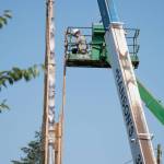The story pole was wrapped in a wood frame before it was lowered June 6 from its long-held post at the Pole Building on Island County Fairgrounds. Photo provided by George Masters