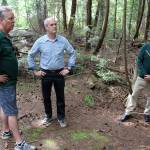 U.S. Rep. Rick Larsen listens to Doug Coutts, left, South Whidbey Parks Recreation District director, and Dennis Hunter, district commissioner, right, talk about the need to acquire 40 acres of private land before its logged and sold to developers. Larsen took a tour of the woods Friday morning. Photo by Patricia Guthrie/Whidbey News Group