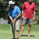 Brian Carroll, left, and Bob Rigwood follow the path of Carrolls putt. (Photo by Jim Waller/South Whidbey Record)
