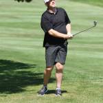 Dean Olmstead follows the flight of his chip shot.(Photo by Jim Waller/South Whidbey Record)