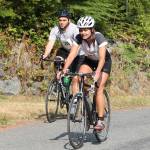 Langleys Kristi Eager bikes by Seattles Andrew Harbert during the Whidbey Island Triathlon last weekend.(Photo by Jim Waller/South Whidbey Record)