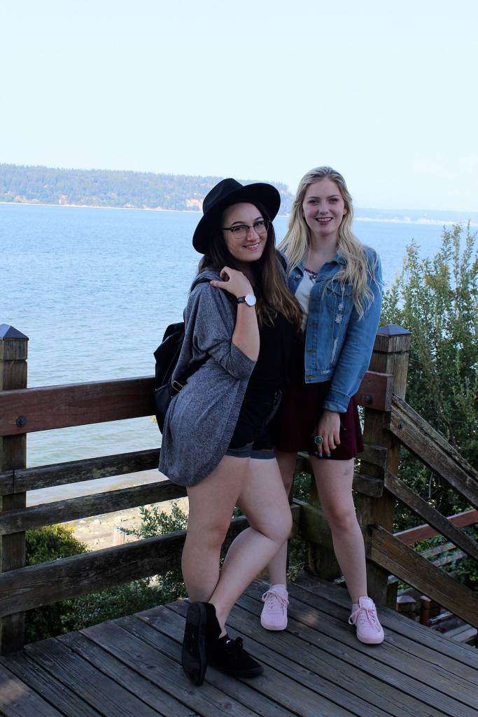 Kelaynna Kikkert, right, and her friend, Marisa Quagla, from British Columbia, strike a scenic photo pose above the Saratoga Passage during a day trip to Langley.