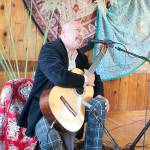 File photo.                                Classical guitarist Andre Feriante of Langley plays at a gathering of Island Bohemians last year. Hes hosting a guitar festival at two South Whidbey wineries Aug. 10-12.