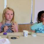 South Whidbey Community Center has transformed Langleys old school into a hub of organizations and activities including social services, learning, creating, playing, cooking and baking. Pressley Moss, 7, left, and Nicholle Sargent, 8, paint rocks as part of Mindfulness Monday, one of many daily programs offered through the summer.
