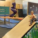 Orson Ruggenberg, 5, demonstrates getting to the big slide inside The Backyard Whidbey. The indoor activity and exercise space for children and adults is owned by his parents, Sarah and Zach Ruggenberg. Its located at the back of the South Whidbey Community Center inside a former school gym. South Island Crossfit, Skagit Valley College, Veterans Resource Center, Opportunity Council, Big Brothers/Big Sisters and Tiger Martial Arts are also among 25 tenants. (Photos by Patricia Guthrie/Whidbey News Group)