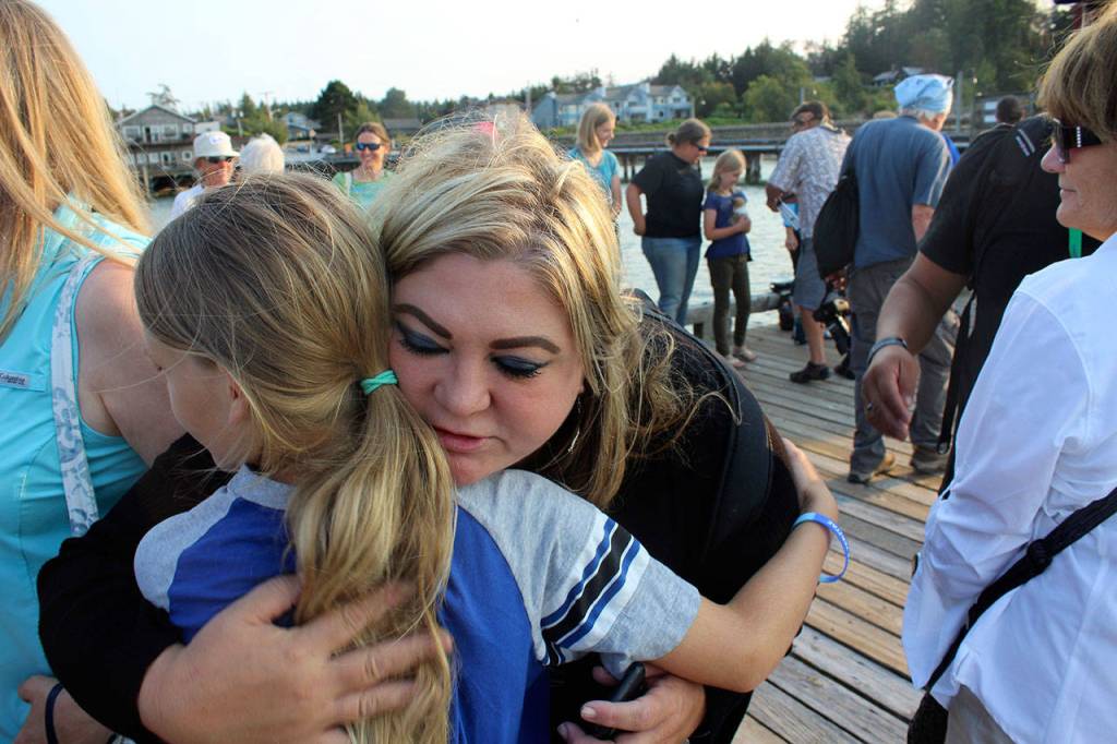 Michelle Seidelman, with Sea Shepherd in Portland, makes the round of hugs that ended the somber event. She travels to the Bring Lolita Home gathering every year.