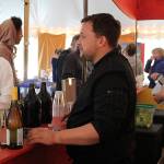 David Phillips pours wine and beer while Caelan Boyd serves food during Island Shakespeare Festival performances.