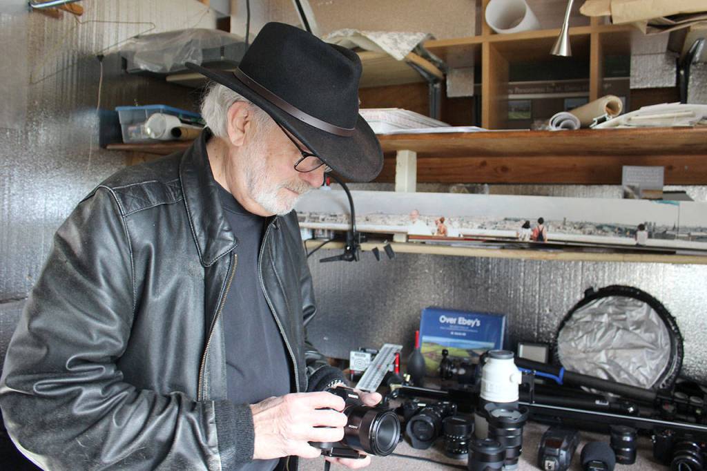 Coupeville photographer Denis Hill, known for his panoramic images of Ebeys Landing National Historical Reserve, is also part of the 15th Annual Summer Open Studio Tour. (Photo by Patricia Guthrie/Whidbey News Group)<address> </address>