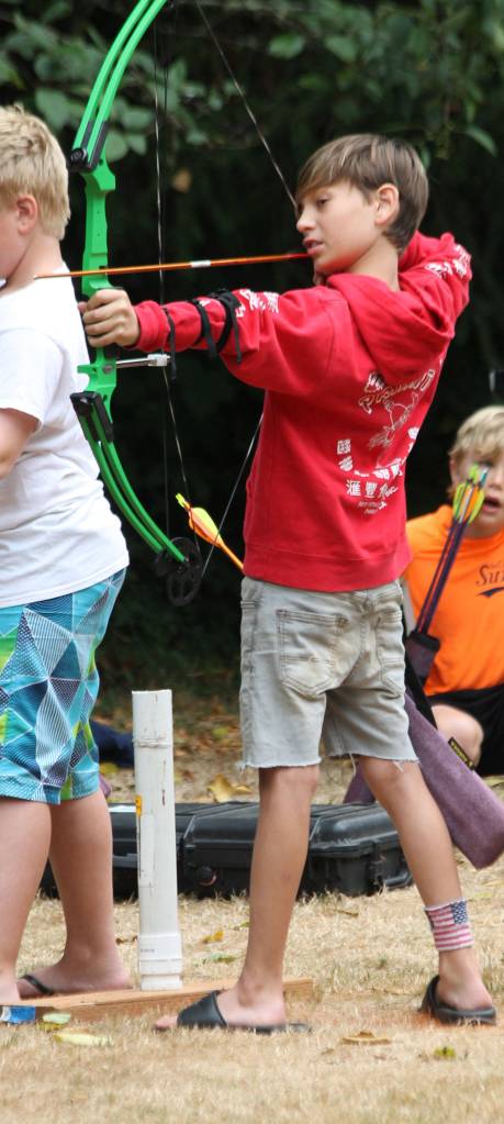 Hugh Evans tries for a bulls-eye.(Photo by Jim Waller/South Whidbey Record)